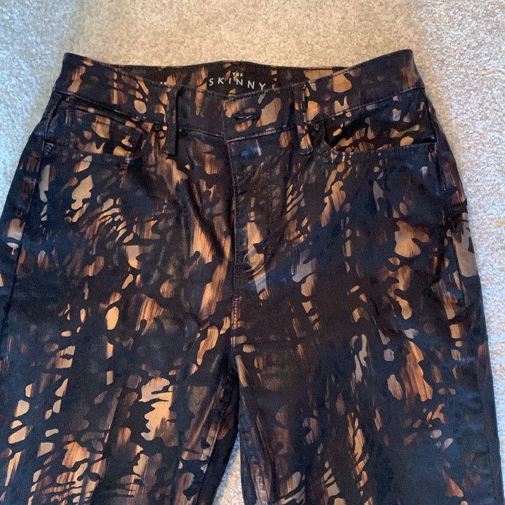 Like new black WHBM jeans with gorgeous metallic print.